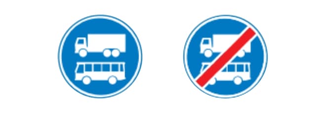 Twee ronde blauwe verkeersborden. Links bord F19: een pictogram van een witte vrachtwagen boven een pictogram van een witte bus, waarmee een rijbaan wordt aangegeven die zowel bedoeld is voor vrachtverkeer als bussen. Rechts bord F20: dezelfde pictogrammen van een vrachtwagen en een bus, maar met een diagonale rode streep erdoor, waarmee het einde van de tram- en busbaan wordt aangegeven.